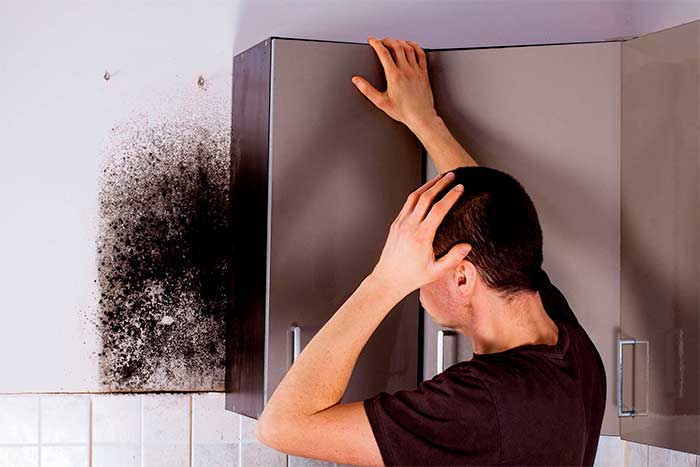 DIY-vs.-professional-mold-removal-man-think-how-to-remove-the-mold
