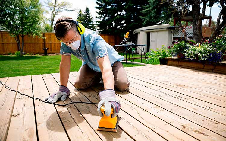 How to prepare a deck for repainting man clean deck