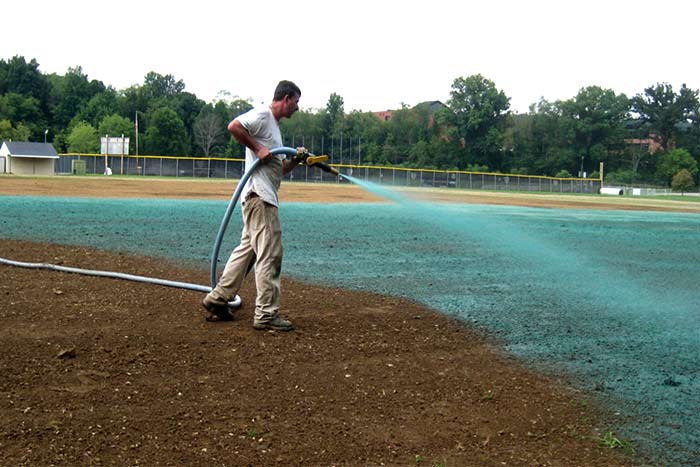 Is It Cheaper to Hydroseed Myself man work on garden