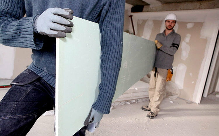 What thickness does drywall come in men hold the drywall