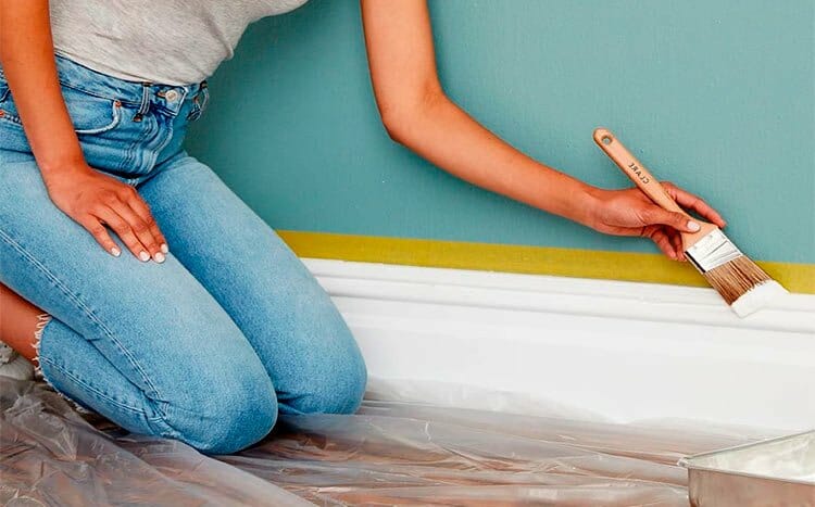 Which option gives the best results painting the walls or trim first woman paints the wall