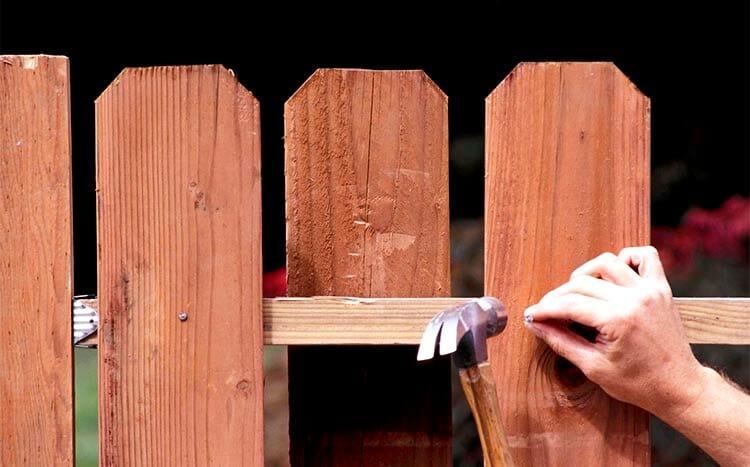 Can My Neighbor Build A Fence on The Property Line wooden fence