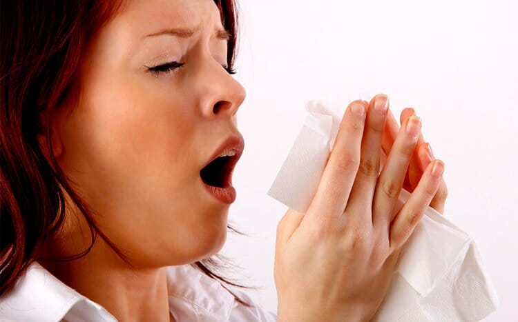 How can mold make you sick woman s sneezing