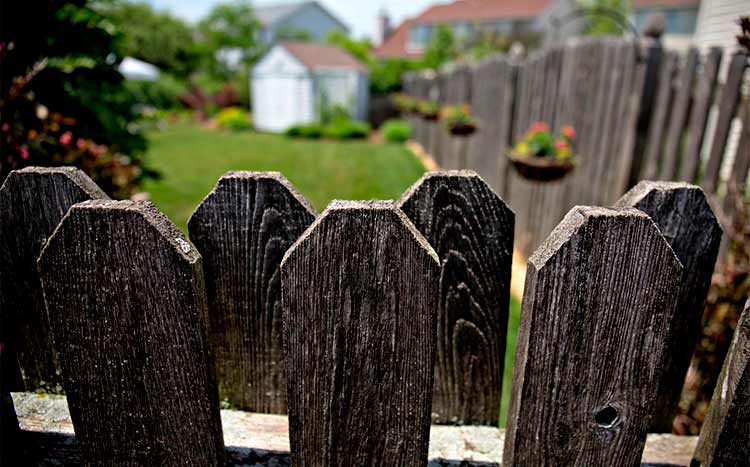 Can I put up a fence on my side of the property line wooden fence