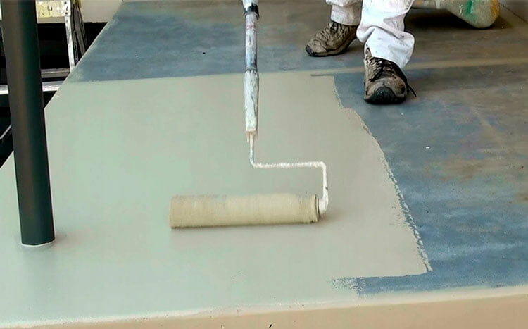 Applying Drylok concrete floor pain