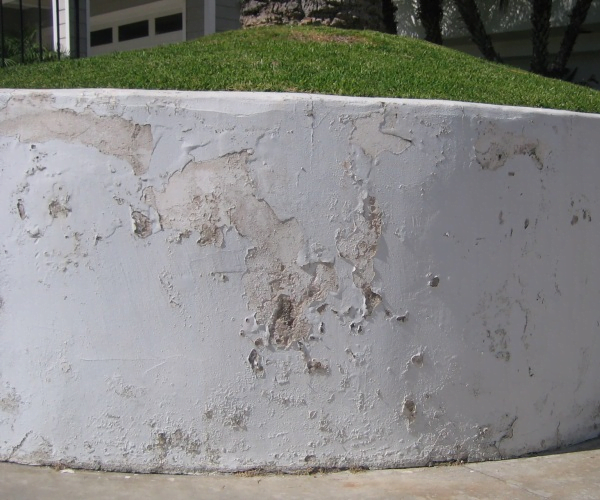 What causes stucco damage