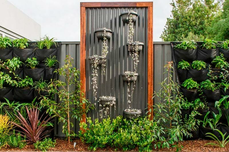 Corrugated Metal Fence with Border Plants