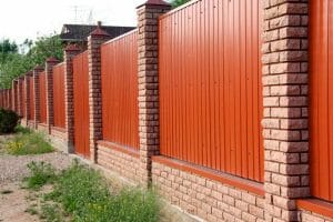 Corrugated Metal and Brick Fence