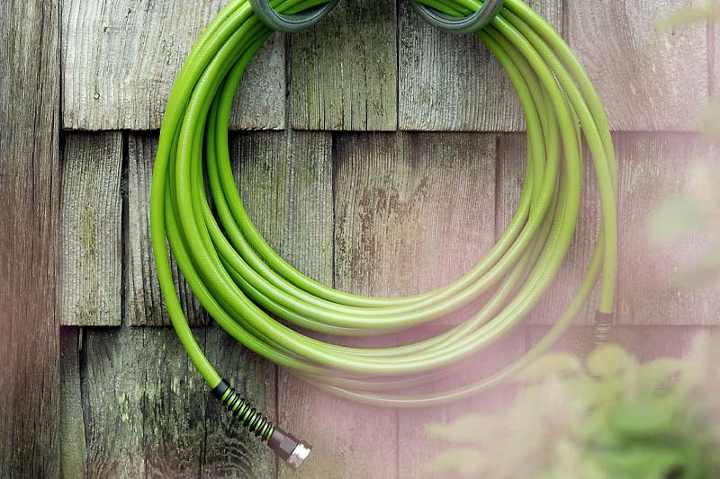 Step 2 Use a garden hose to rinse your fence