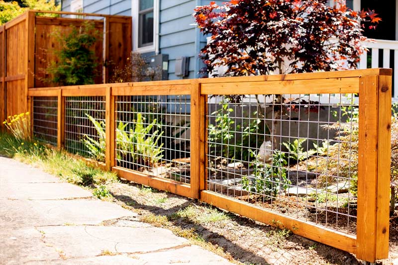 Hog wire fence with wooden frames